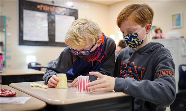students work to build a bridge
